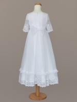 Biała sukienka do Komunii z szeroką, koronkową falbaną.jpg